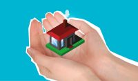 pair of hands holding graphic of model home pair of hands holding graphic of model home