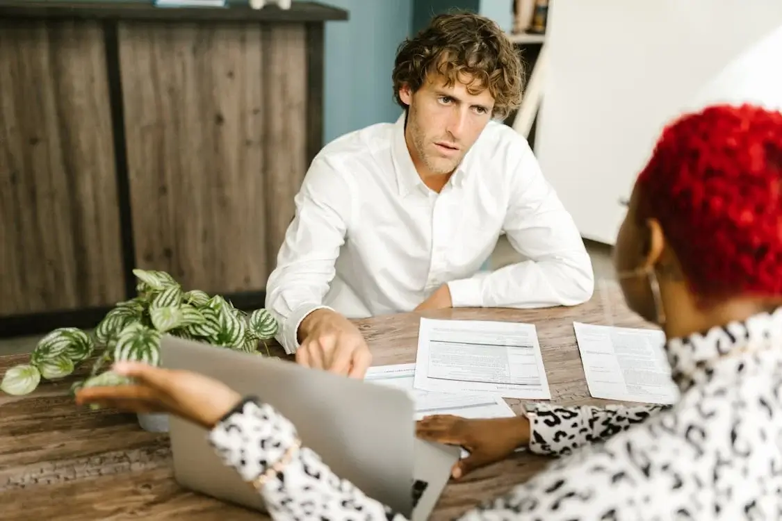insurance claims adjuster in conversation with client